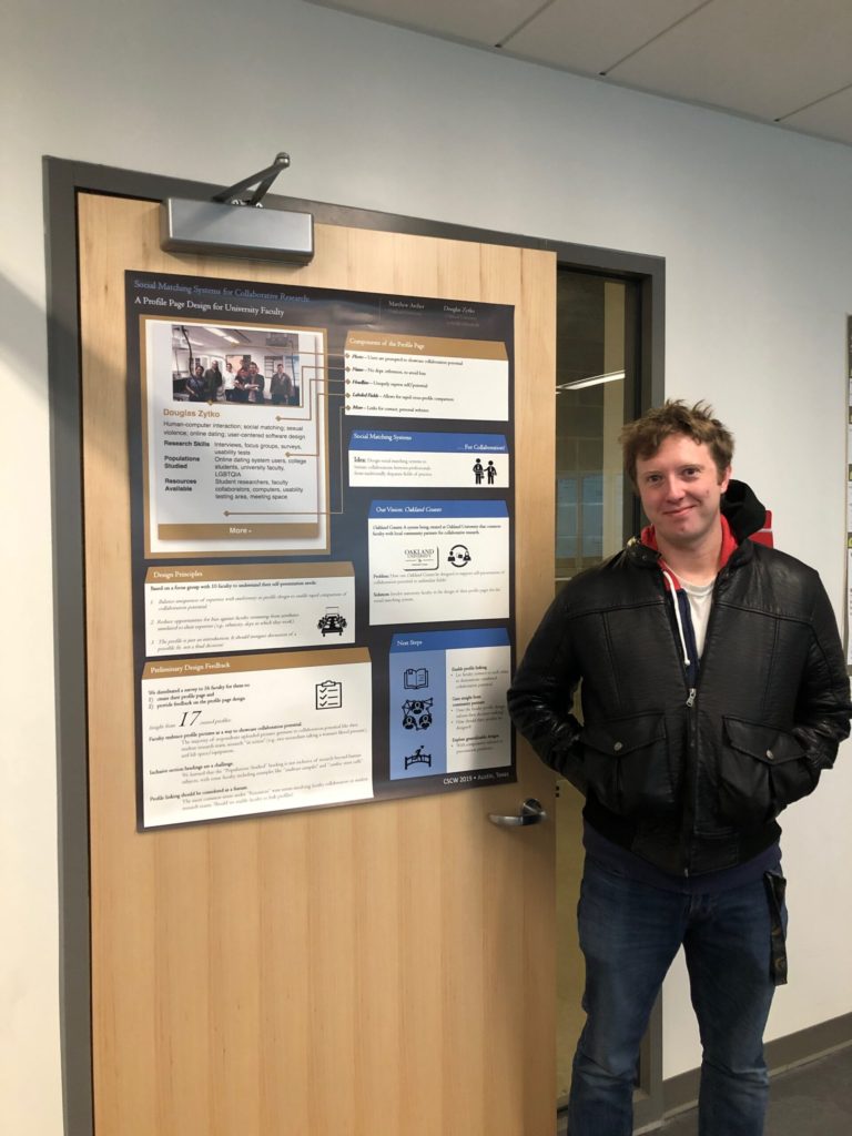 Matt Archer in front of research poster